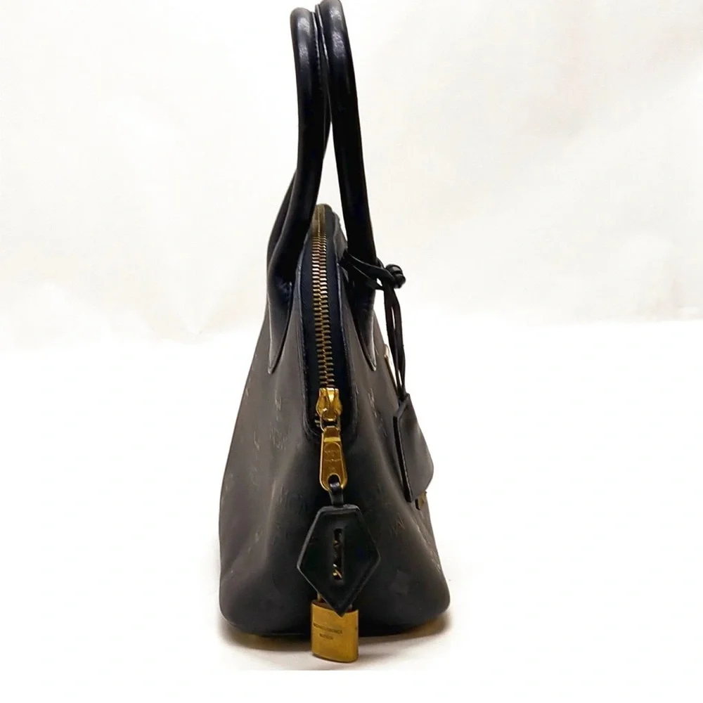 MCM Black Satchel with Gold Accents lock and key included authentic